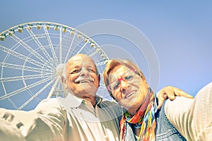 Happy retired senior couple taking selfie at travel time