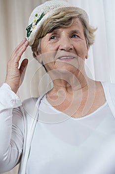 Happy retired woman in boater photo