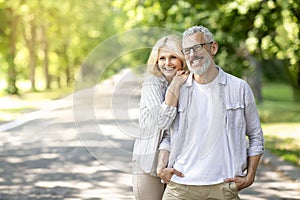 Happy Retirement. Romantic Senior Couple Relaxing Together In Sunny Park