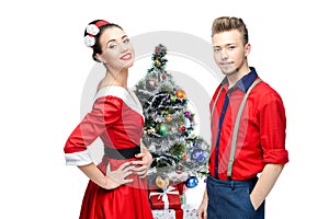 Happy retro couple near christmas tree