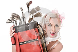 Happy retro girl peeking out from behind red golf bag, isolated