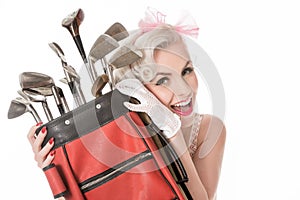 Happy retro girl peeking out from behind red golf bag, isolated