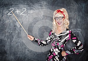 Happy retro teacher in glasses with wooden pointer