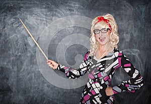 Happy retro teacher in glasses with wooden pointer
