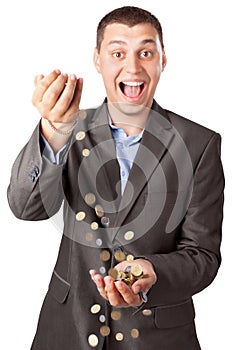 Happy rich businessman pouring coins