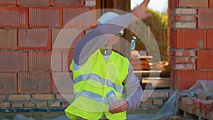 Happy rich real-estate agent architect selling new house, service man in uniform with cash income