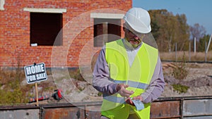 Happy rich real-estate agent architect selling new house, service man in uniform with cash income