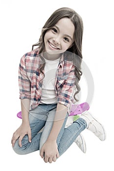 Happy ride. Kid girl happy sits penny board. Originally designed as girls skateboard. Modern teen hobby. Girl happy face
