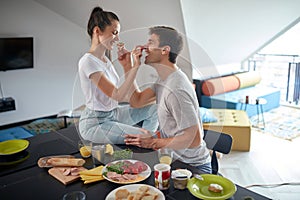 Happy romantic cople having breakfast together