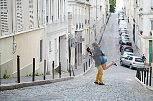 Happy romantic couple is hugging on Montmartre