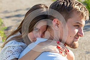 Happy romantic couple in love and having fun outdoor in summer day, beauty of nature, harmony concept