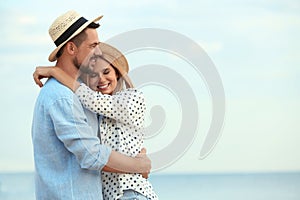 Happy romantic couple spending time together on beach