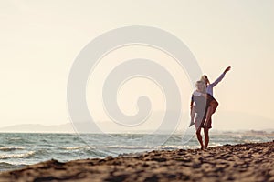 Happy Romantic Middle Aged Couple Enjoying Beautiful Sunset Walk on the Beach