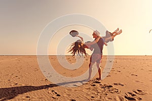 Happy Romantic Middle Aged Couple Enjoying Beautiful Sunset Walk on the Beach