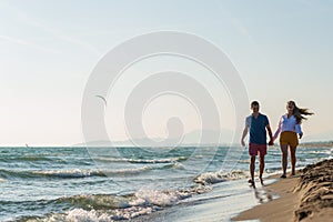 Happy Romantic Middle Aged Couple Enjoying Beautiful Sunset Walk on the Beach