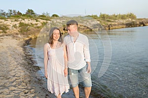 Happy Romantic Middle Aged Couple Enjoying Beautiful Sunset Walk on the Beach