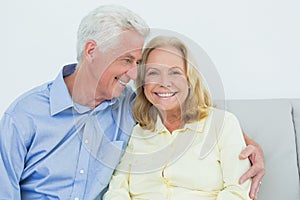 Happy romantic senior couple at house