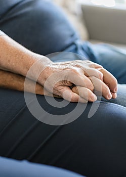 Happy romantic senior couple in love holding hands