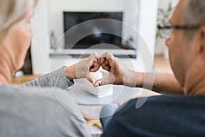 Happy romantic senior couple in love at home