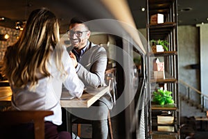 Happy romantic smiling people having date in restaurant. Couple in love.