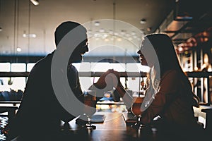 Happy romantic smiling people having date in restaurant. Couple in love.