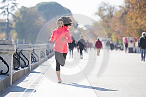 Happy runner woman in Autumn or Winter sportswear running and tr