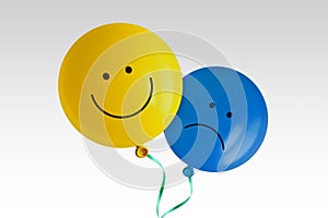 Happy and sad balloon on white background - Concept of positive and negative mood