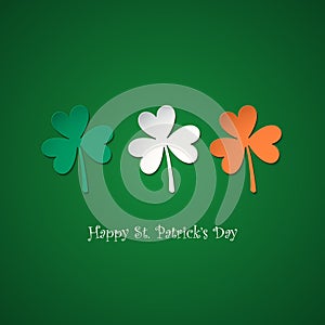 Happy Saint Patrick`s Day greeting card with lucky clovers in colors of the irish national flag.