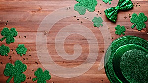 Happy Saint Patrick`s Day greeting card with traditional symbols, shamrock, green attire. Green hat, bow tie, St Patricks Day