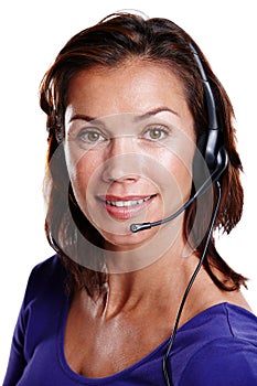 Happy sales representative. Close up portrait of an attractive woman in her 30s smiling at the camera while wearing a