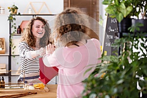 Happy saleswoman selling skincare products photo