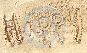 Happy - sand writing