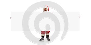 Happy Santa Claus pointing on blank advertisement banner background with copy space. Smiling Santa Claus pointing in
