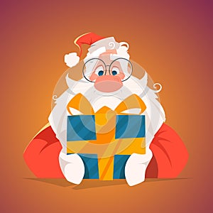 Happy santa holding a gift box