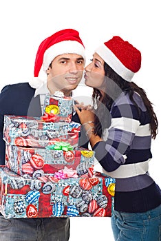 Happy Santa man being kissed by woman photo