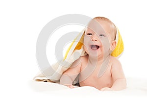 A happy satisfied baby, toddler, newborn, baby covered with a towel after bathing, hygiene in babies, healthy sleep conception, co