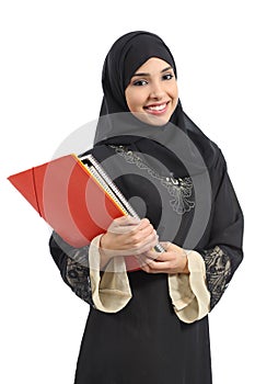 Happy saudi Arab student holding folders photo