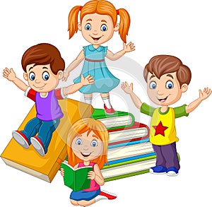 Happy school children with piles of books