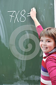 Happy school girl on math classes