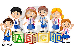 Happy school kids with alphabet block