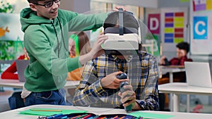 Happy schoolboy taking vr headset from classmate