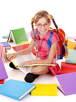 Happy schoolgirl in eyeglasses with pile of books.