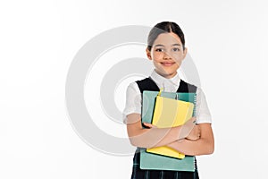 happy schoolgirl standing with notebooks in