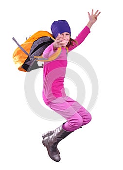 Happy schoolgirl or traveler exercising and jumping