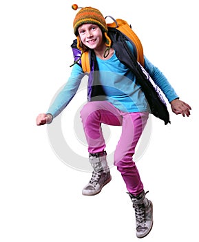 Happy schoolgirl or traveler exercising, running and jumping