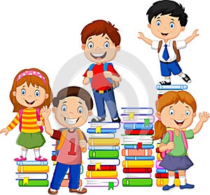 Happy schoolkids playing with stack of book