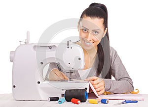 Happy seamstress sewing. isolated on the white