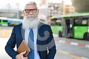Happy senior business man laughing before going to work