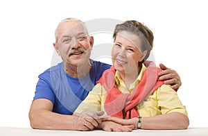 Happy senior couple against white background