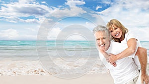 Happy senior couple on the beach.